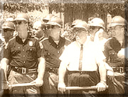 old photo of law enforcement with batons