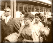 photo of African American high school students being escorted to school